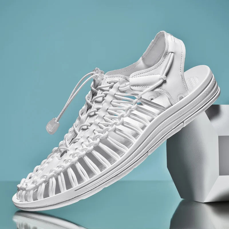 White sneaker with unique sole design on a reflective surface with a teal background
