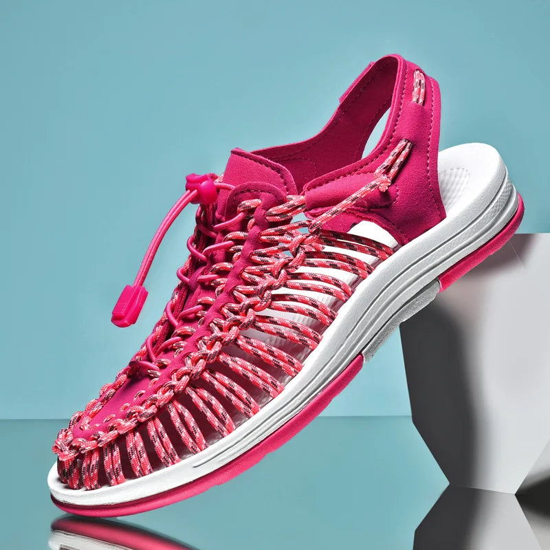 Pink sandal with white sole on a blue background