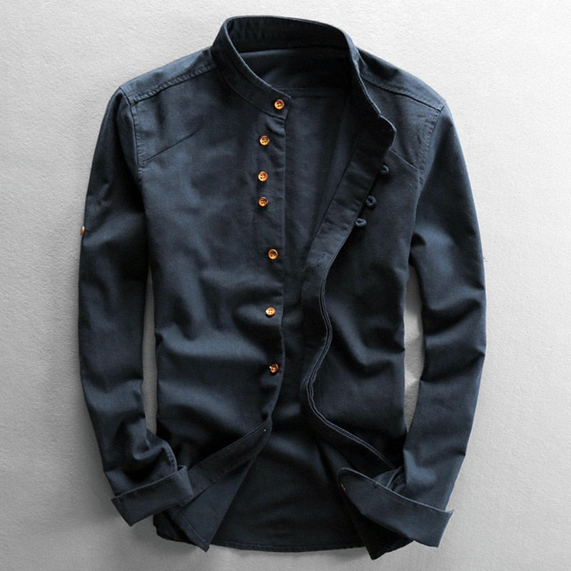 Dark blue shirt with brown buttons on a light gray background