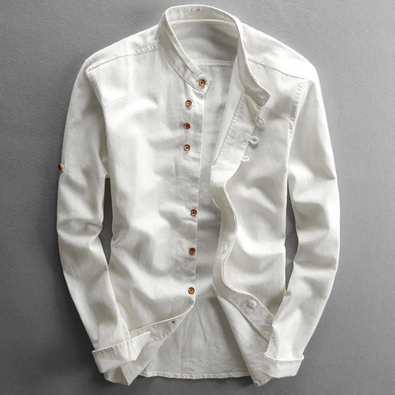 White denim shirt with brown buttons on a gray background