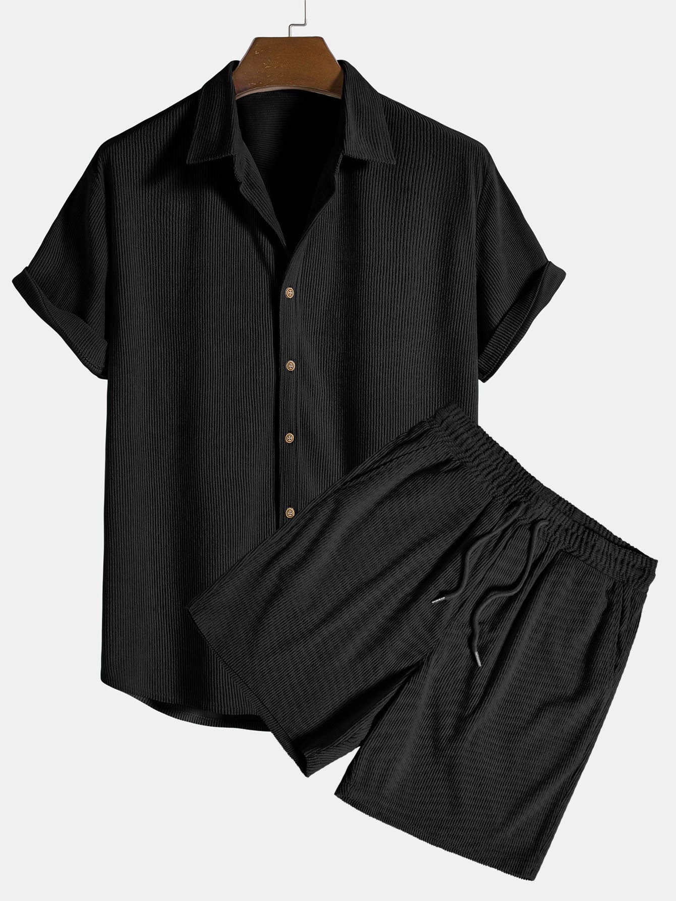 Black short-sleeve shirt and pants set on a hanger against a white background