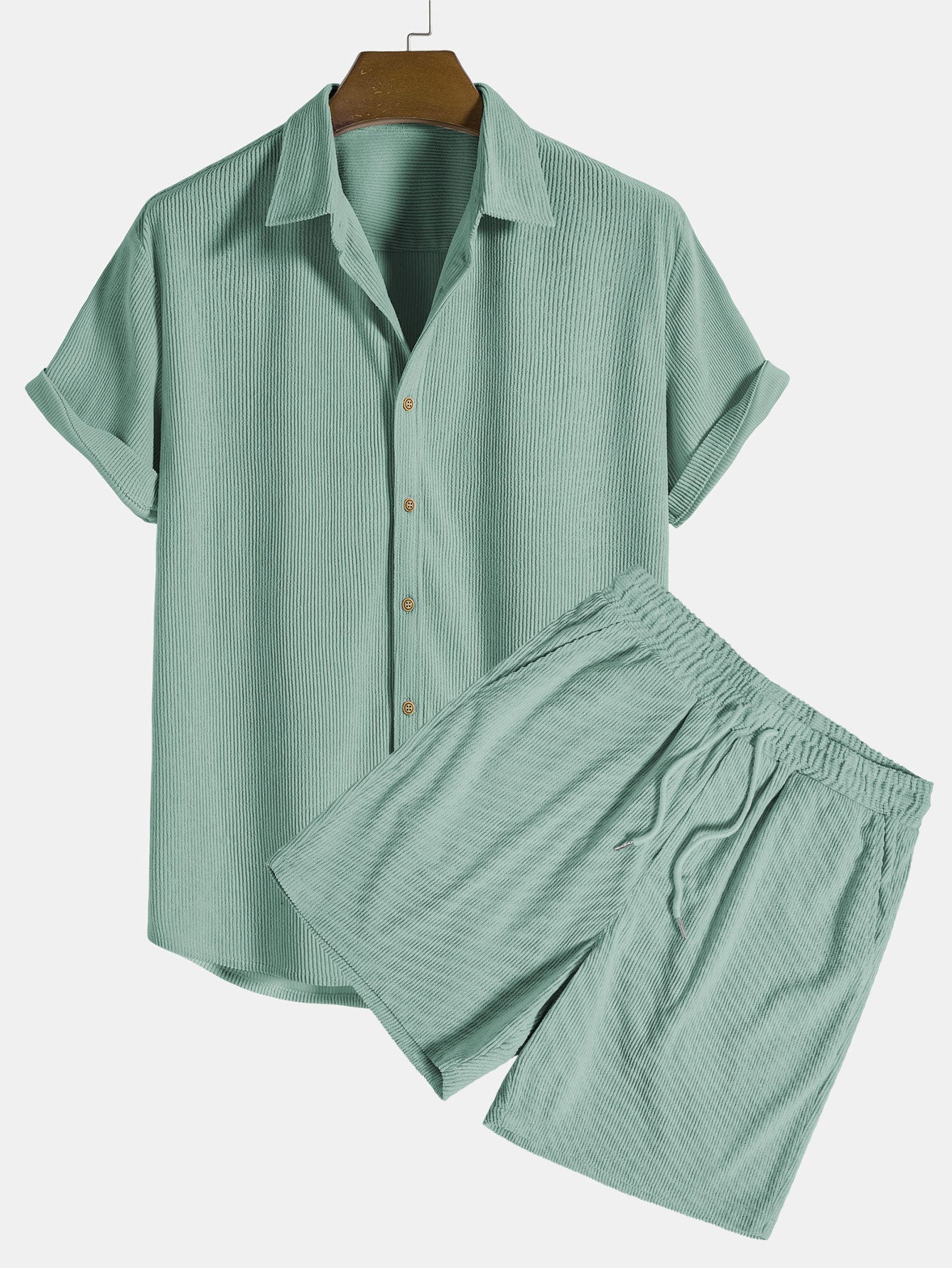 Green checkered shirt and shorts set on a hanger against a white background