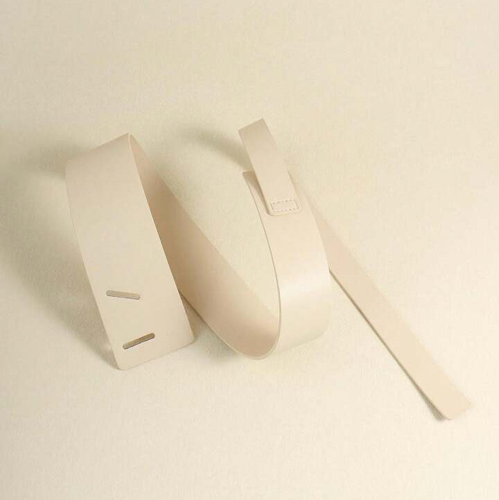 Two beige ribbons on a light beige background