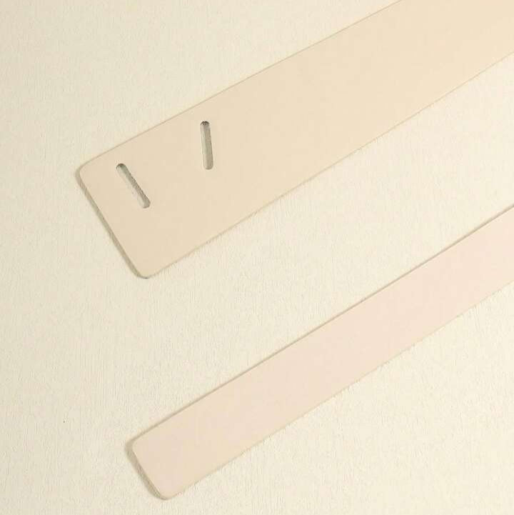 Two beige straps on a light beige background