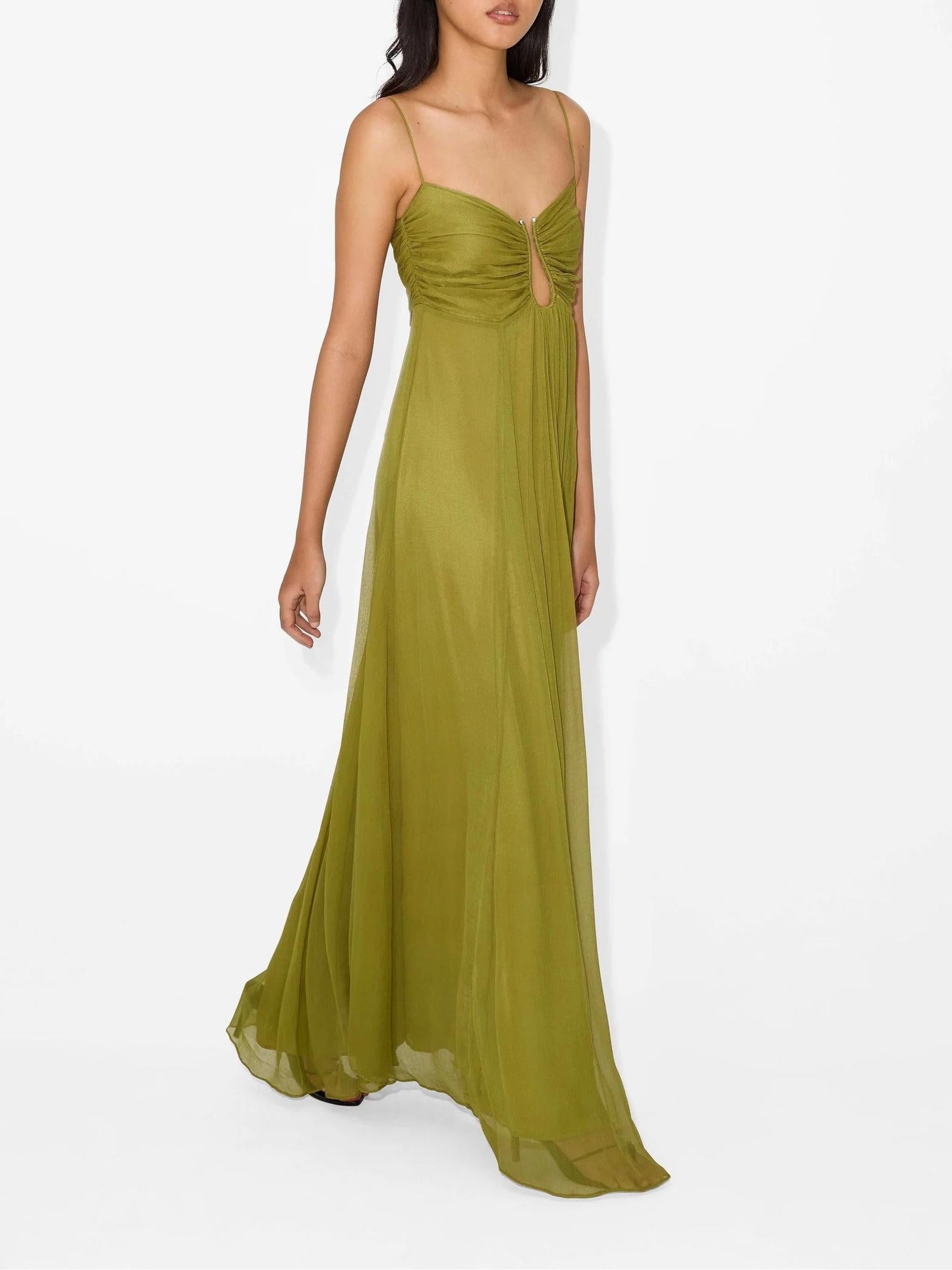 Woman wearing a green evening gown on a white background