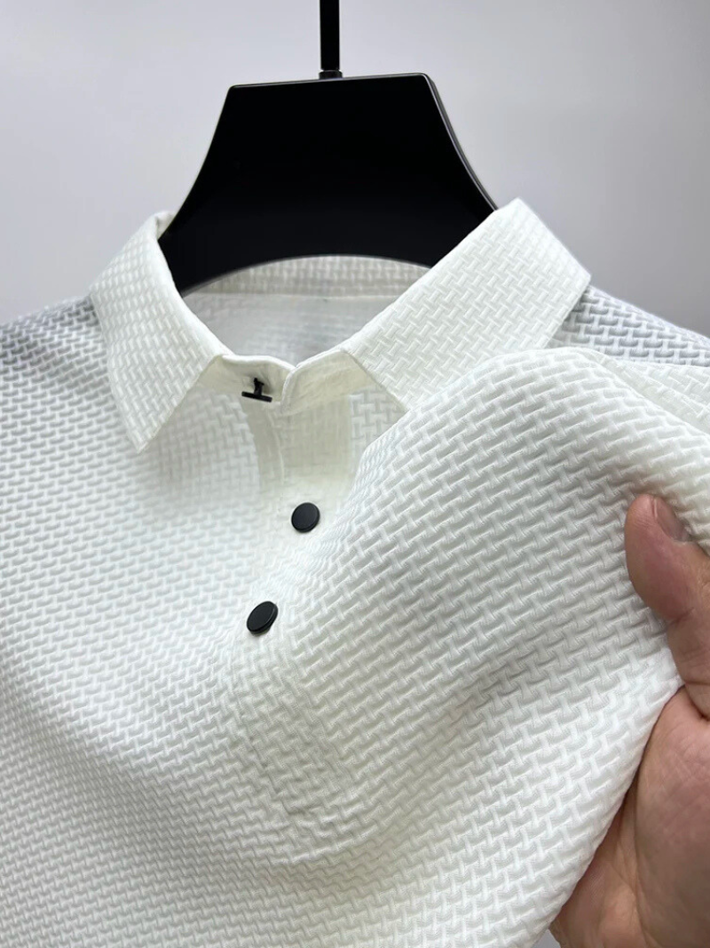 White textured polo shirt with black buttons on a hanger.