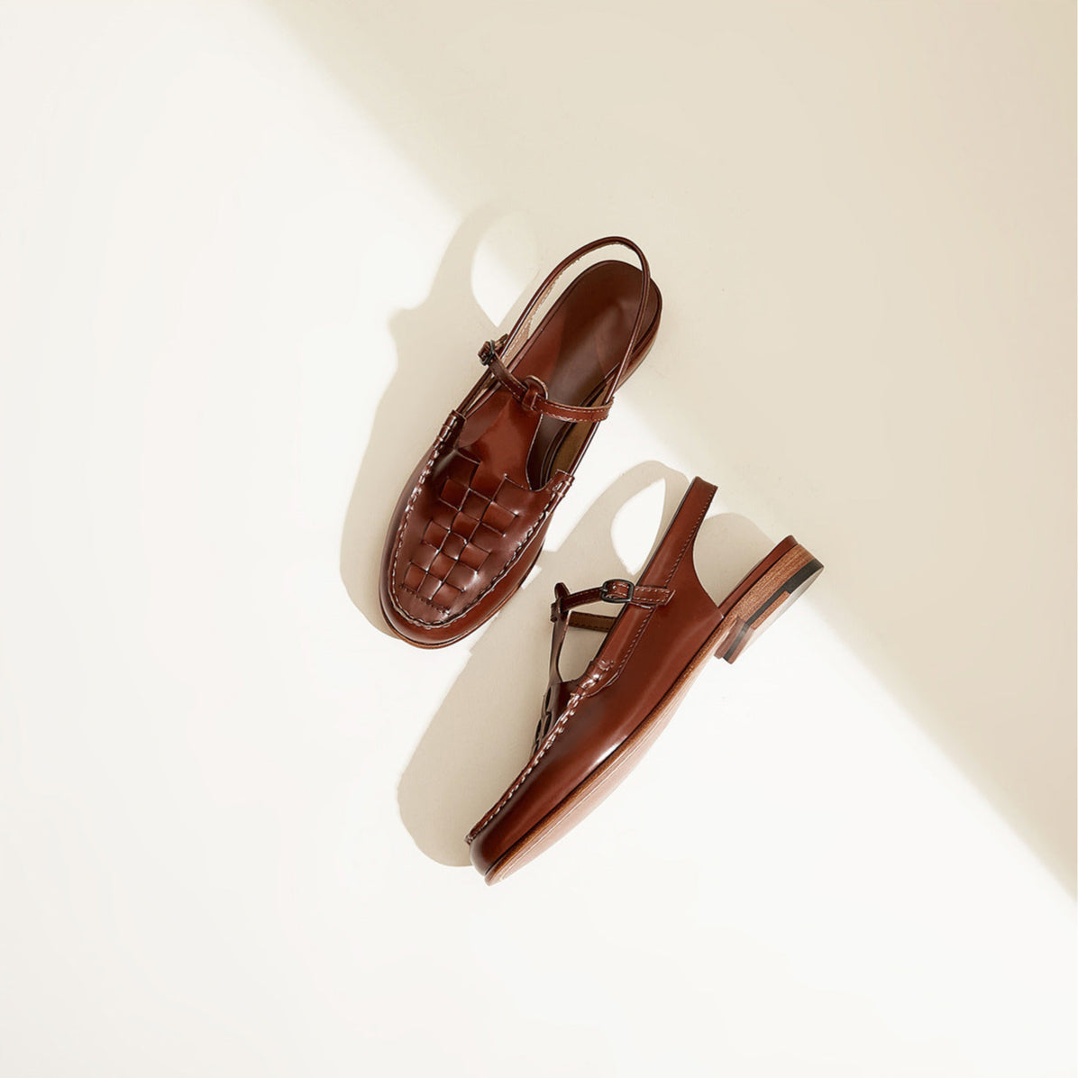Brown sandals on a light beige background