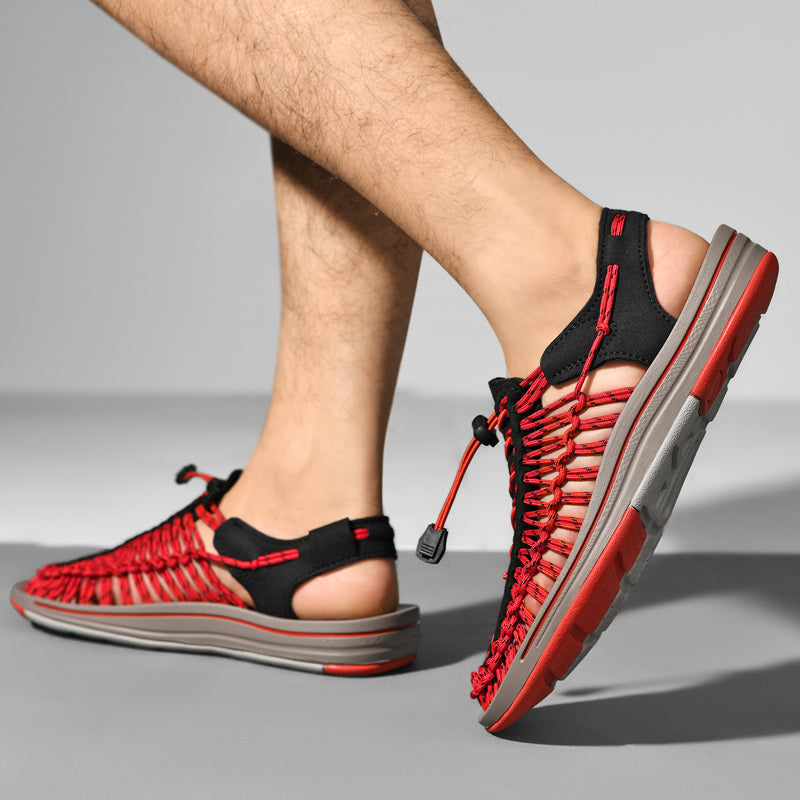 Red and black sandals on a gray background