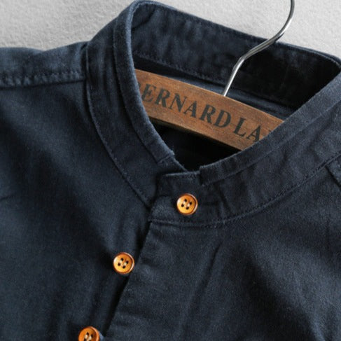 Navy blue shirt with brown buttons