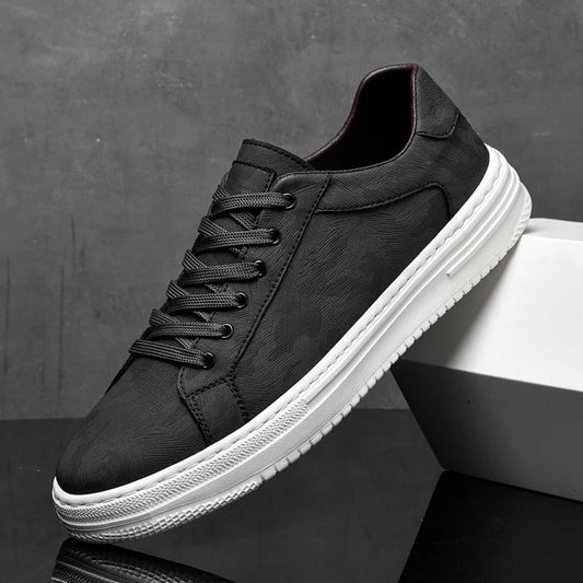Black sneaker with white sole on a dark surface