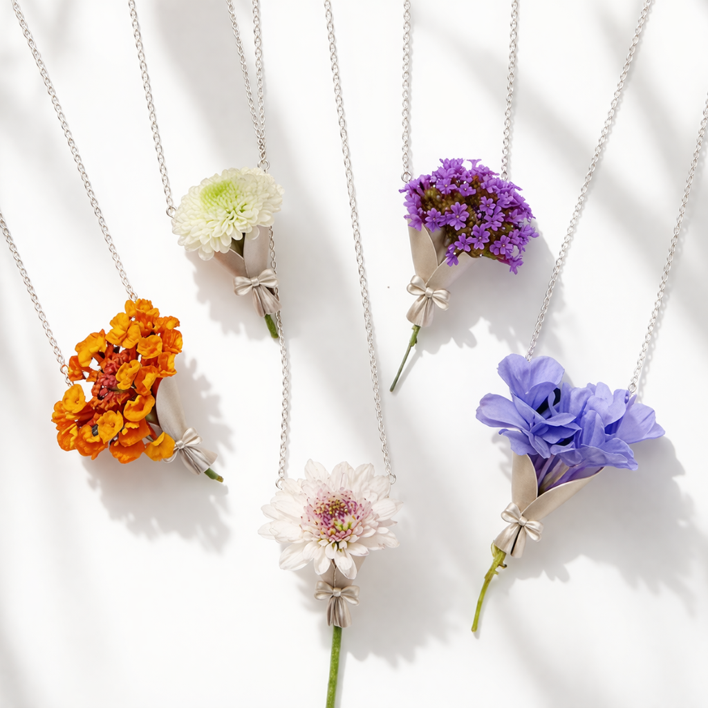 Five floral necklaces with different colored flowers on a white background