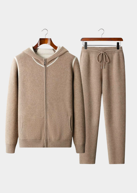 Beige tracksuit on hangers against a white background