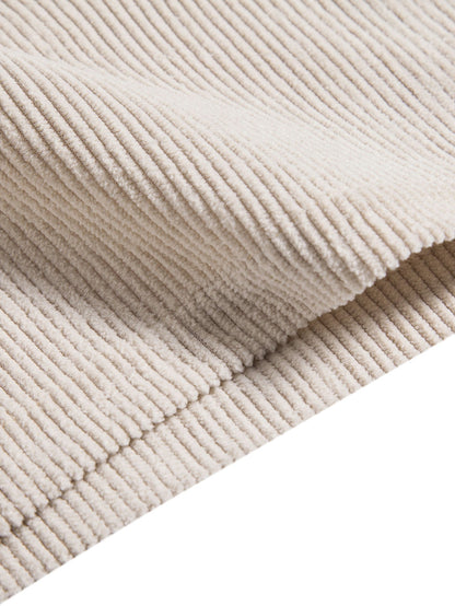 Close-up of beige corduroy fabric with a white background