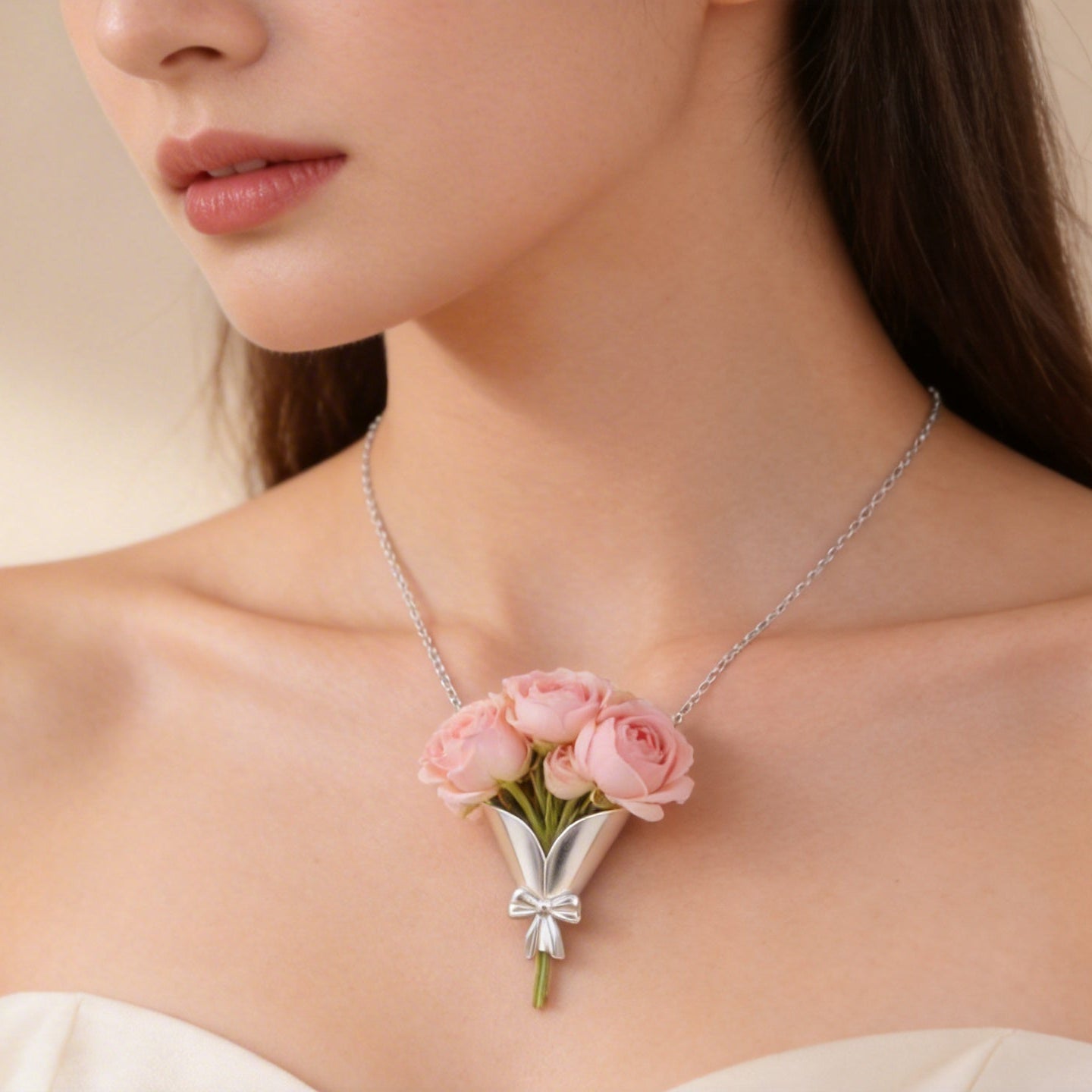 Woman wearing a necklace with a floral pendant on a beige background