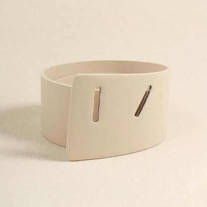 Beige belt with a square buckle on a beige background