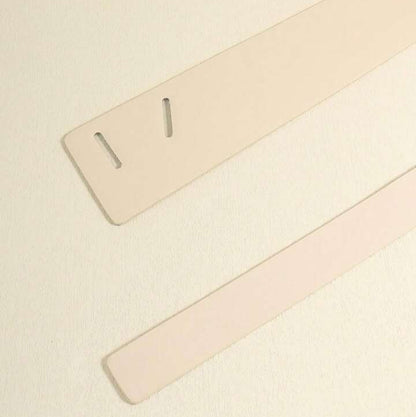 Two beige straps on a light beige background