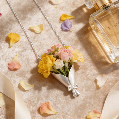 Perfume bottle with flowers and ribbons on a textured surface