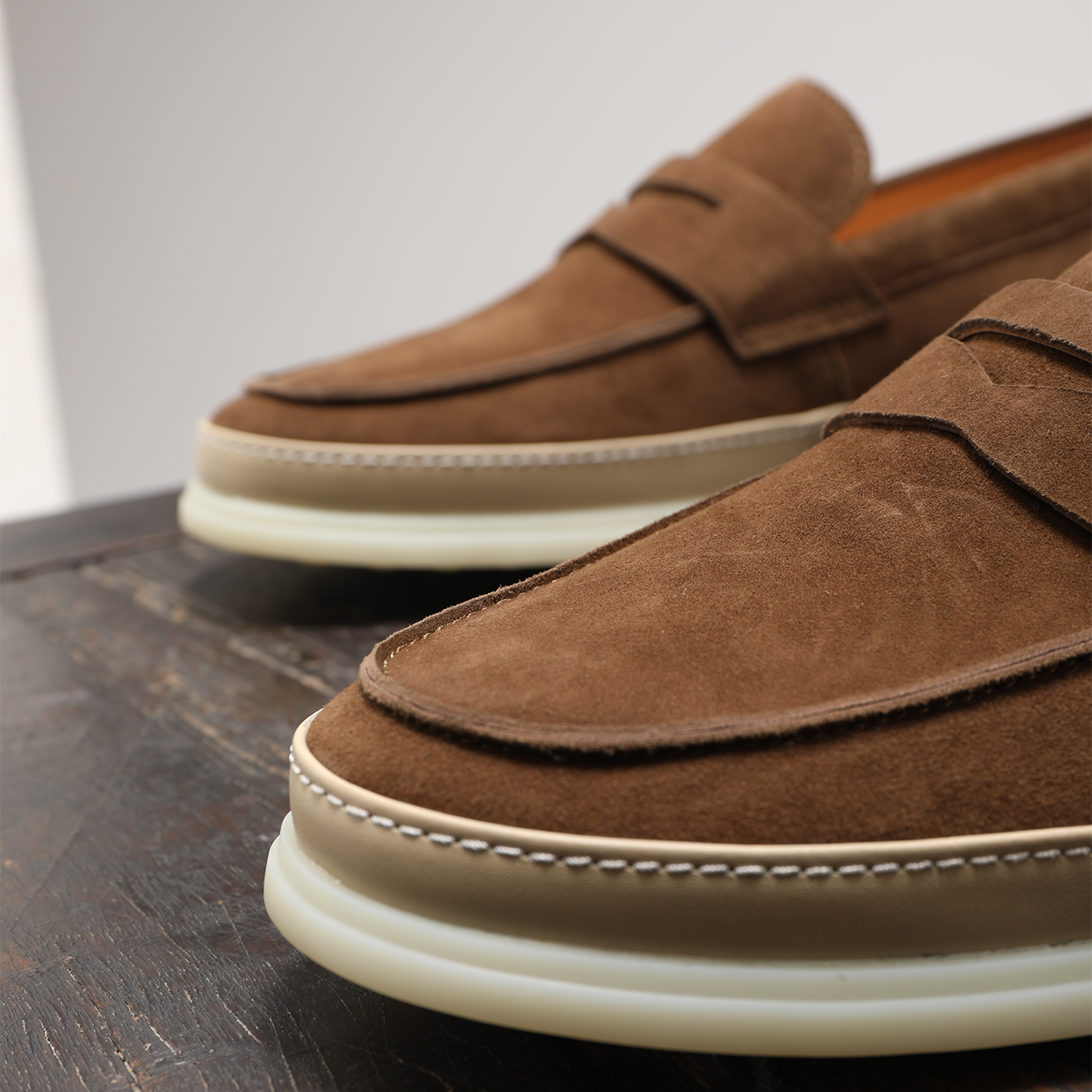 Close-up of brown real suede men’s driving loafers