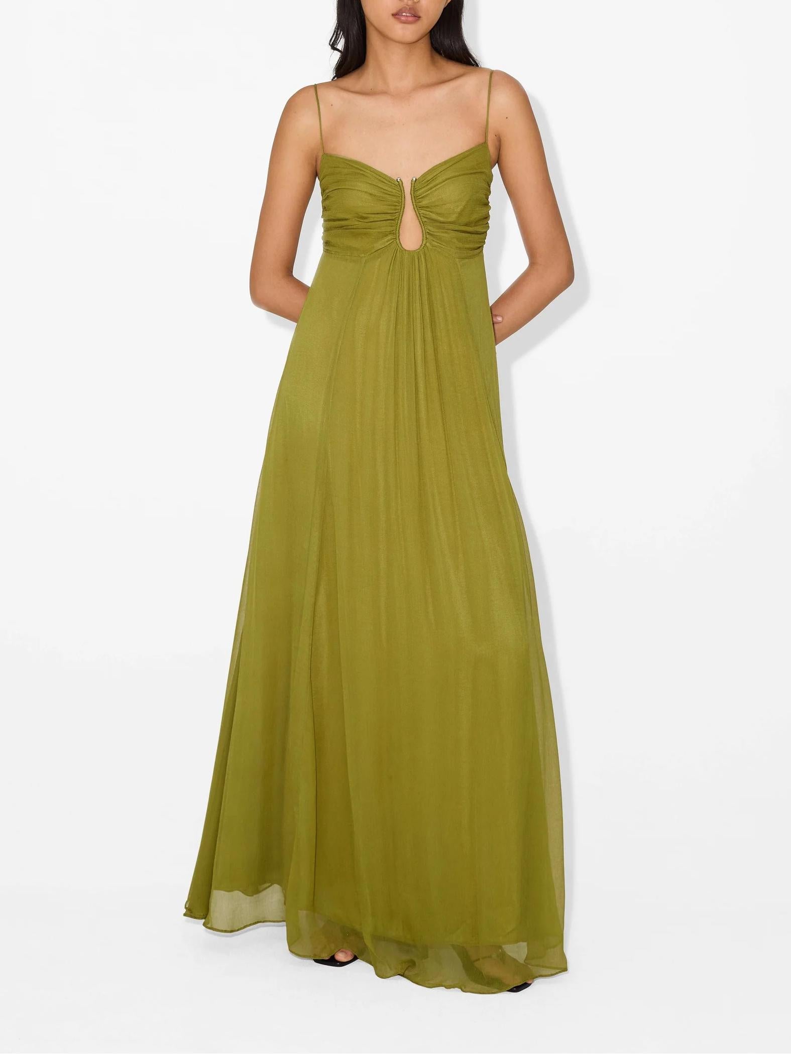 Woman wearing a green evening gown on a white background