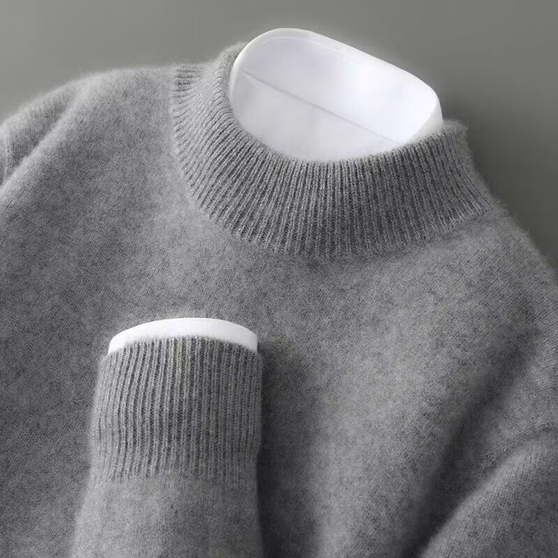 Gray sweater with white collar and cuffs on a gray background