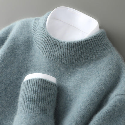 Light blue sweater with white cuffs and hem on a gray background