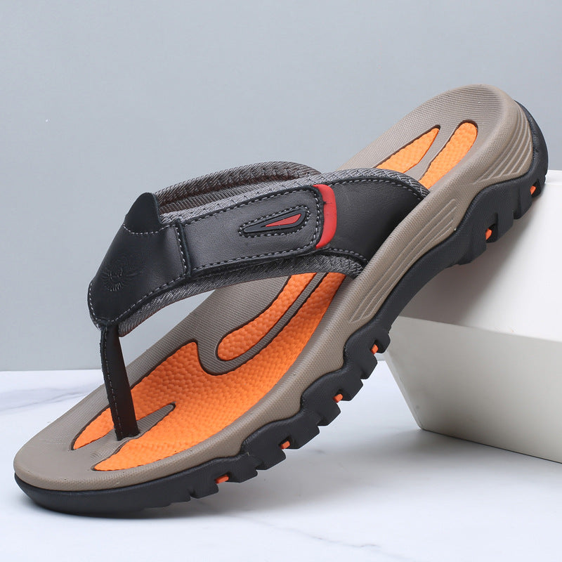 Gray and orange sandal on a light gray background