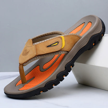 Brown and orange sandal with a gray background
