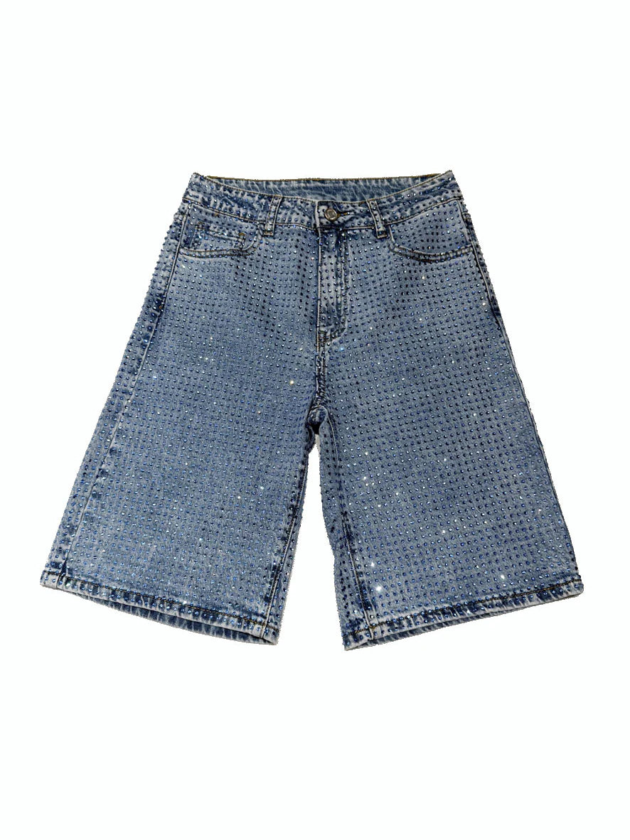 Blue denim shorts on a white background