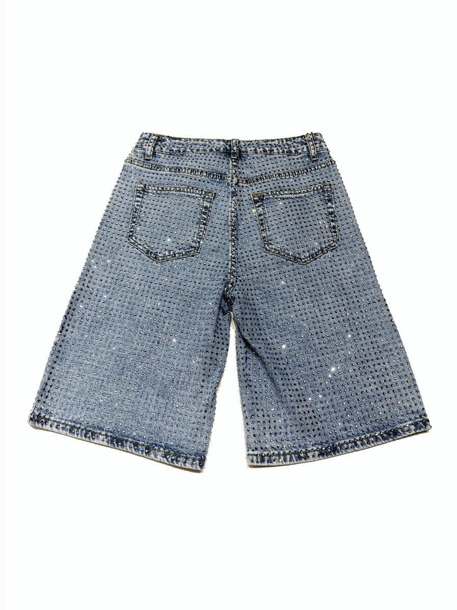 Blue denim shorts with a subtle pattern on a white background