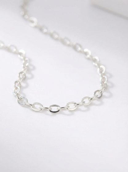 Silver chain necklace on a white background