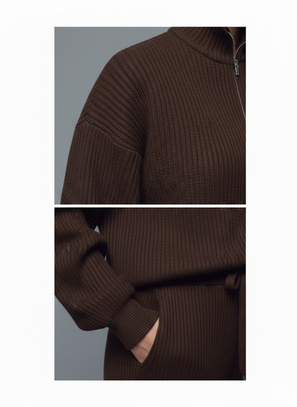 Brown ribbed sweater with a high collar and cut-out detail on a gray background