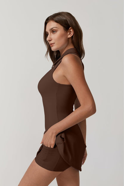 Woman wearing a brown sleeveless top and shorts on a light gray background
