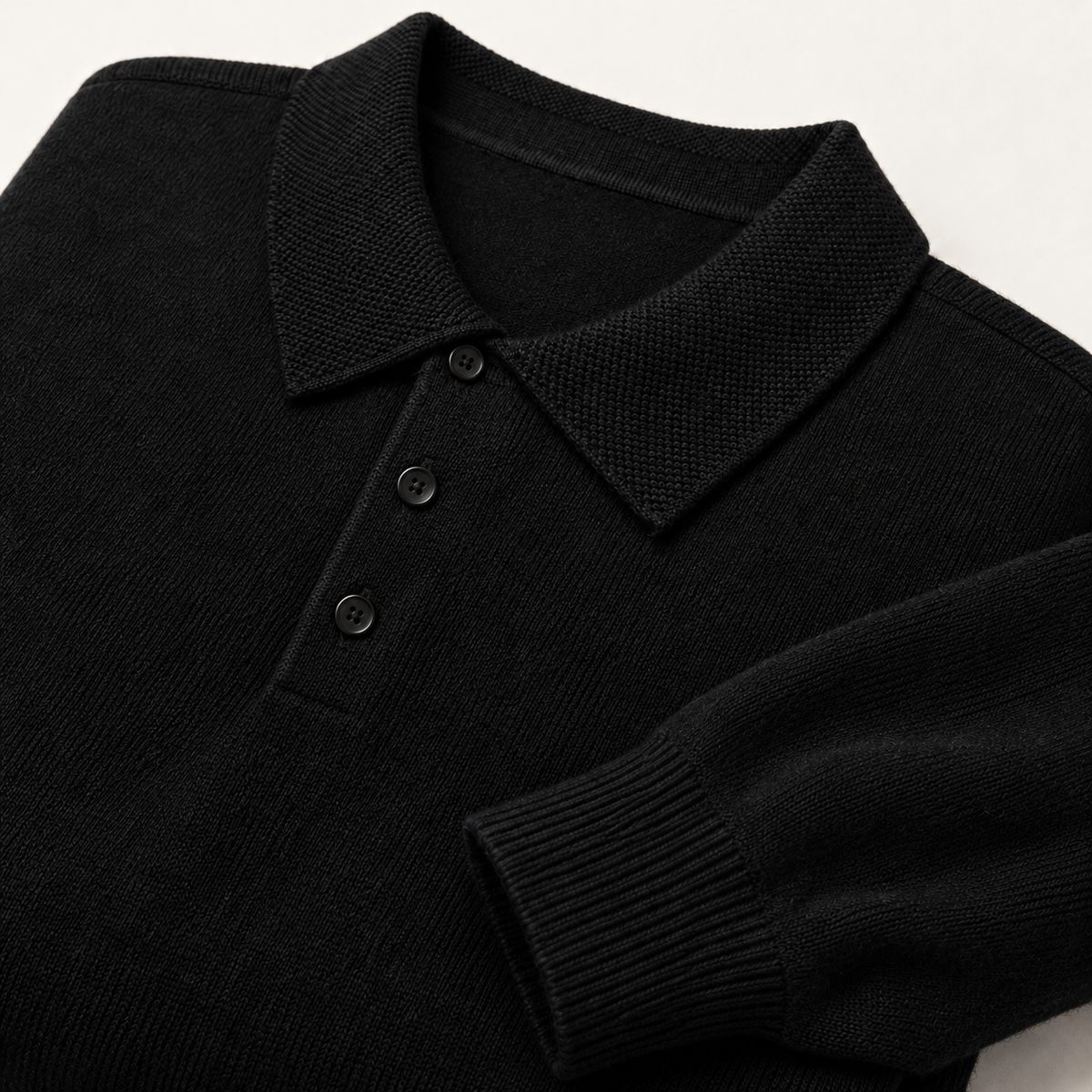 Alden Black — knitted collar, three dark buttons and ribbed cuff close-up