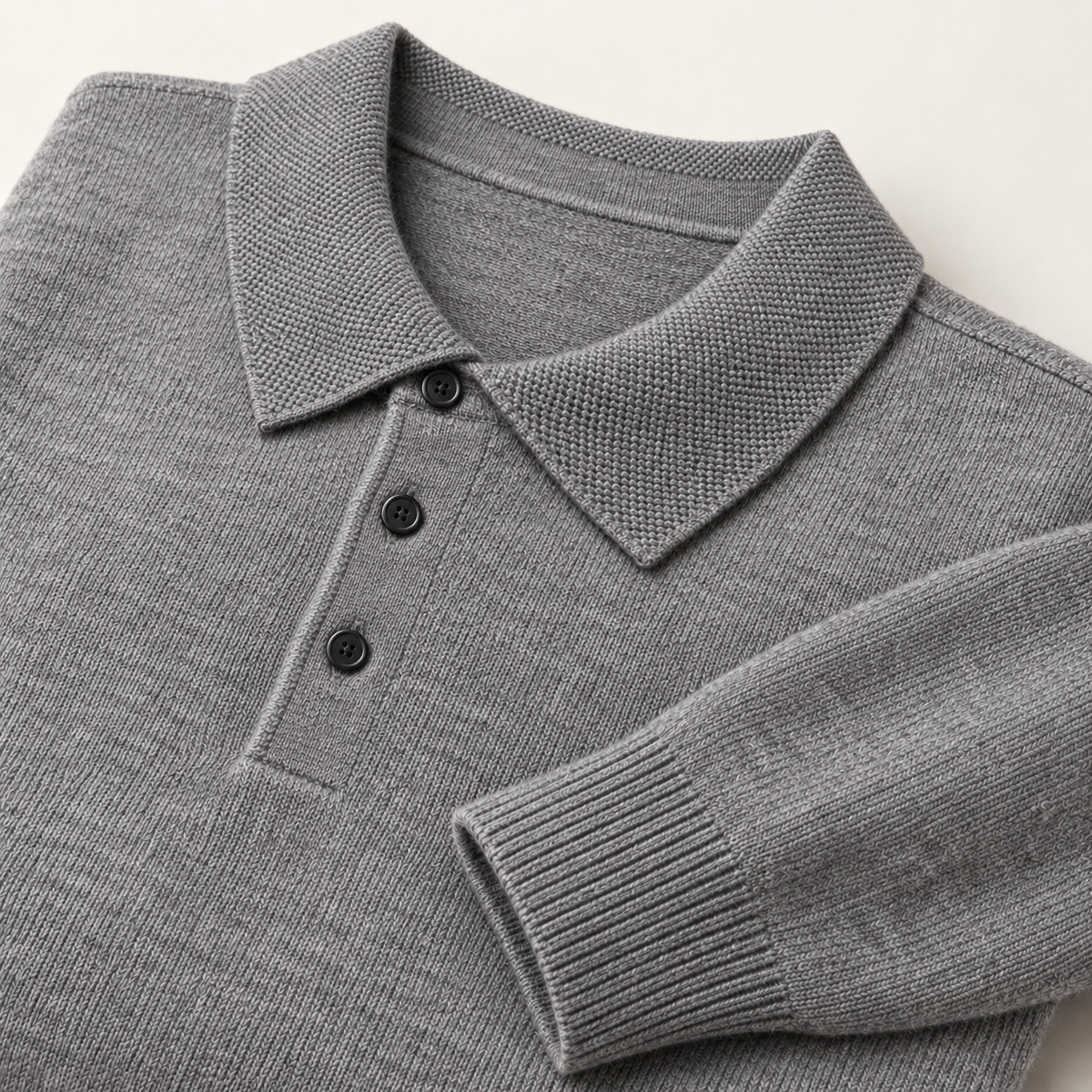 Alden Gray — knitted collar, three dark buttons and ribbed cuff close-up