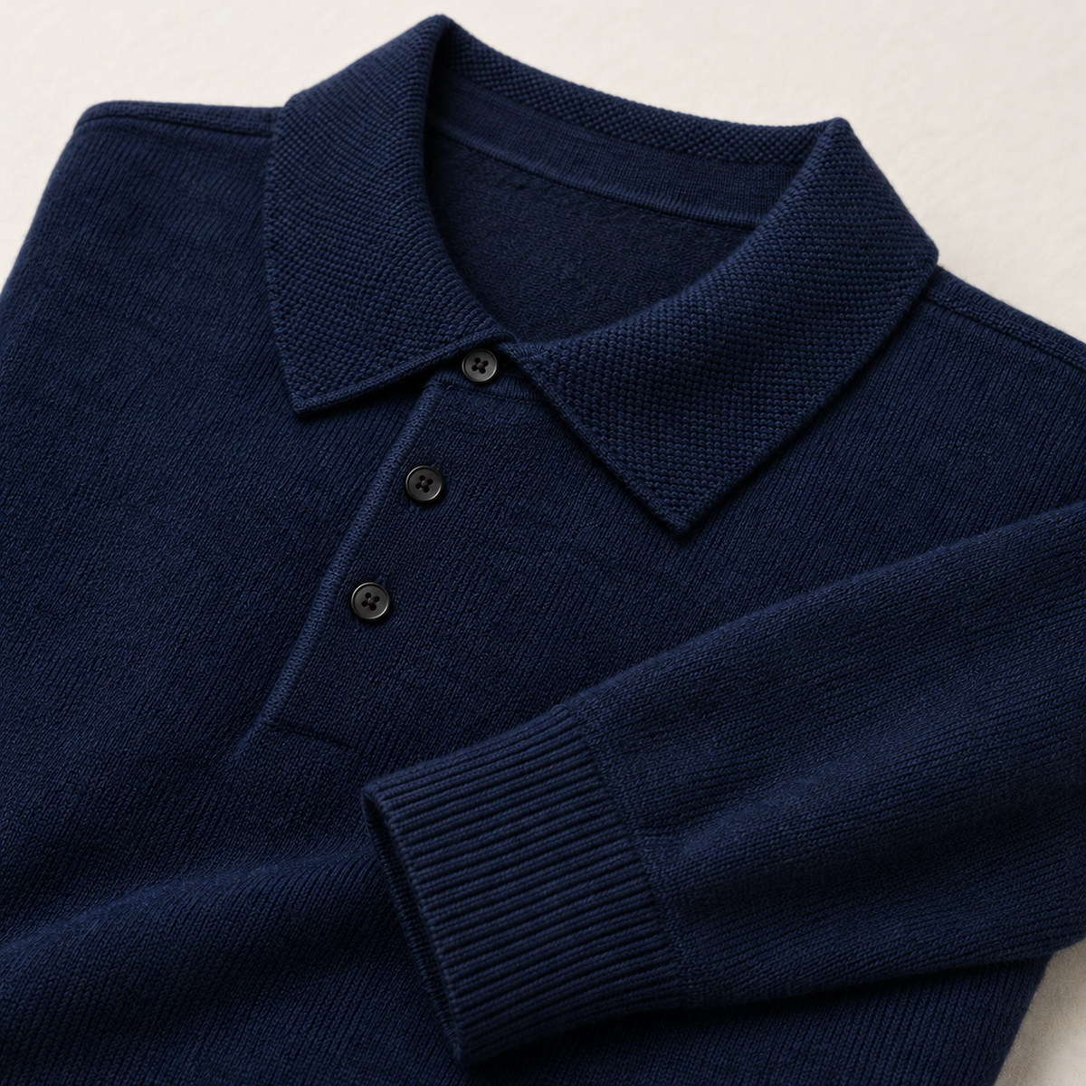 Alden Navy Blue — knitted collar, three dark buttons and ribbed cuff close-up