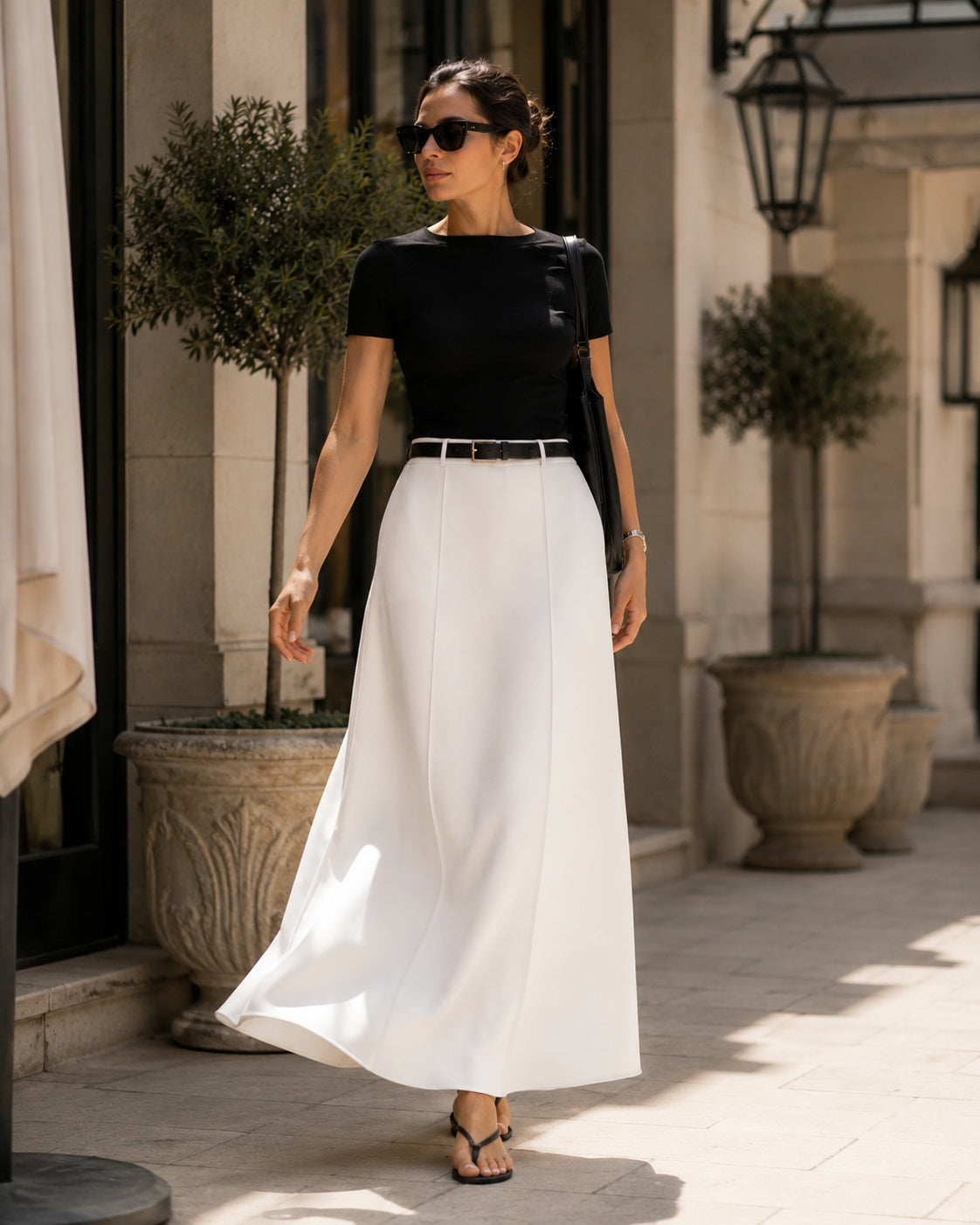Alice Casual Midi Skirt in white styled for a sunny courtyard walk