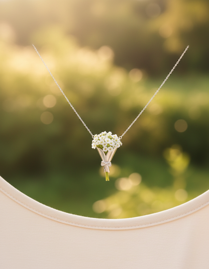 Necklace with a floral pendant against a blurred natural background
