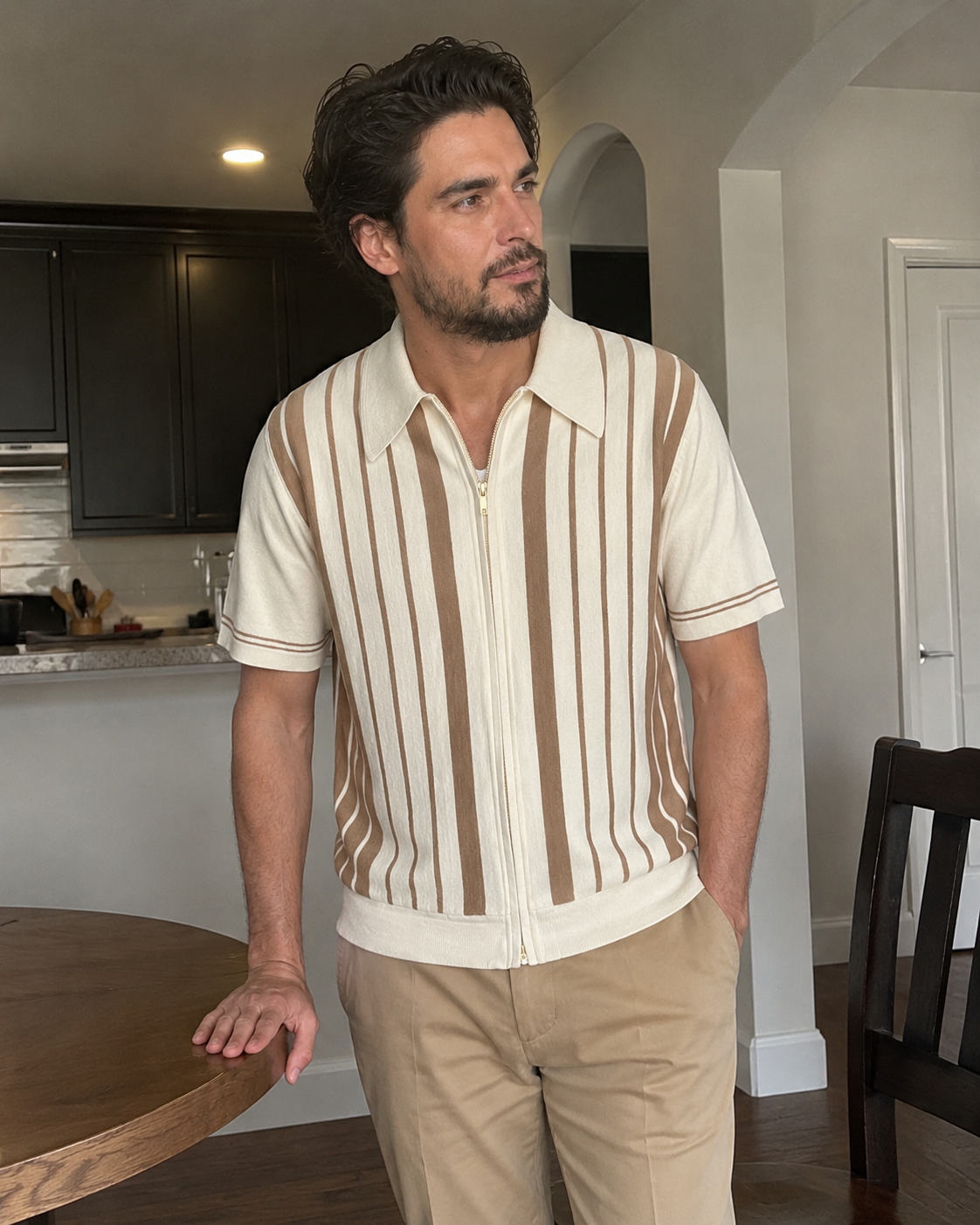 Modern kitchen style photo of a man aged around 28 to 38 wearing the Riviera striped knit zip polo