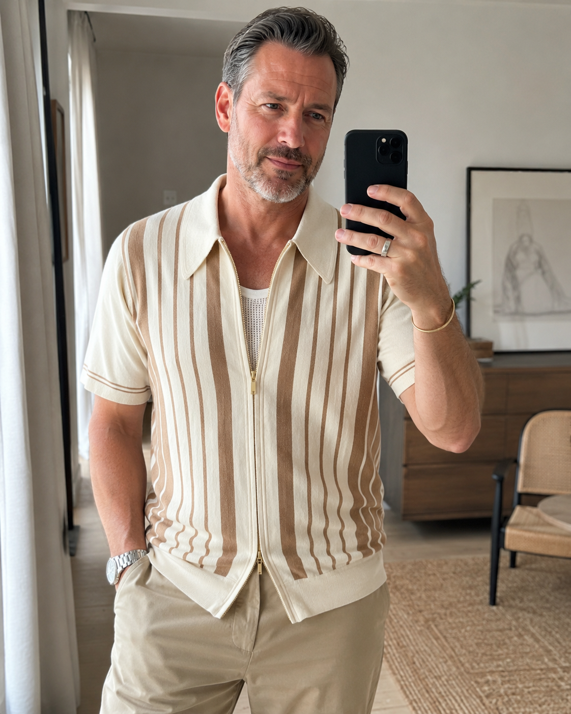 Amateur home style photo of a man over 40 wearing the Riviera striped cotton knit zip polo