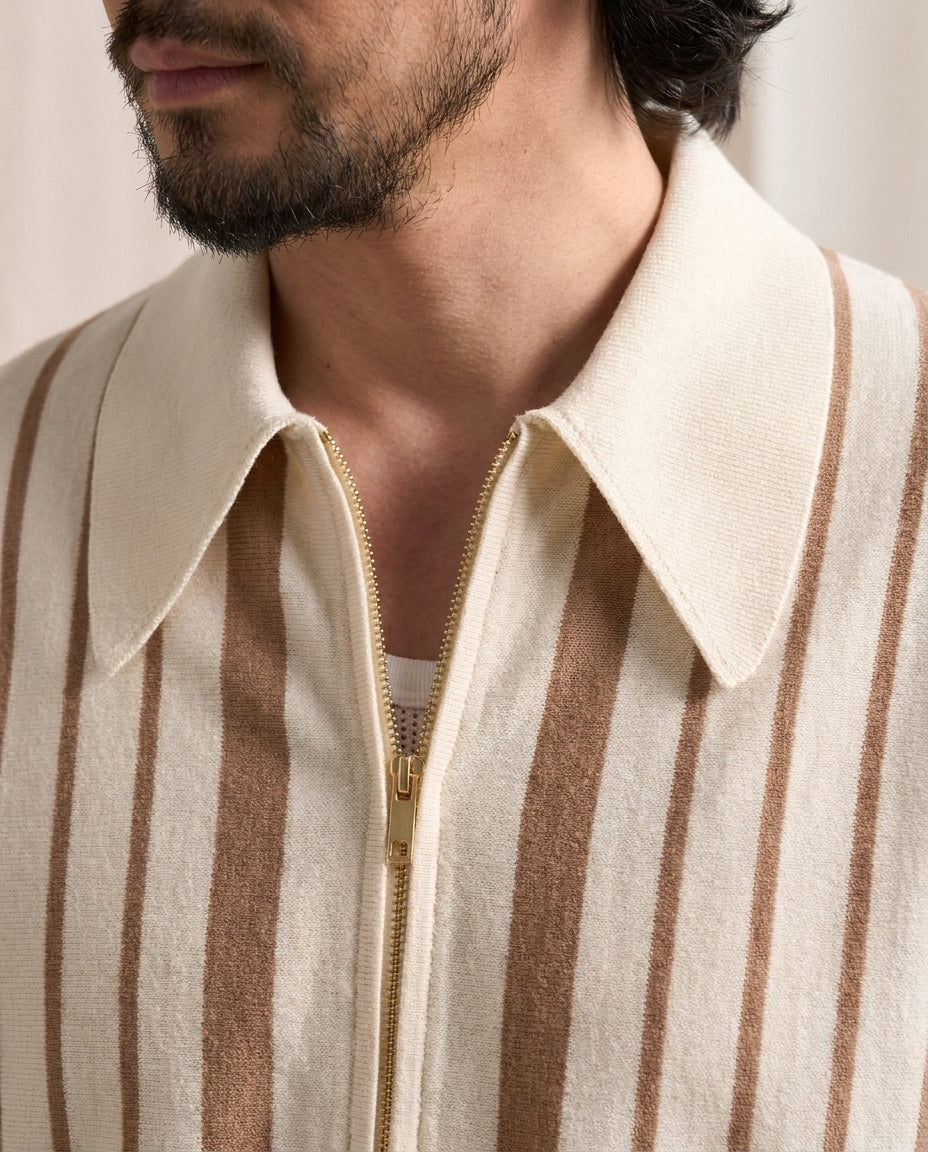 Close-up of the cotton knit polo collar and gold zipper