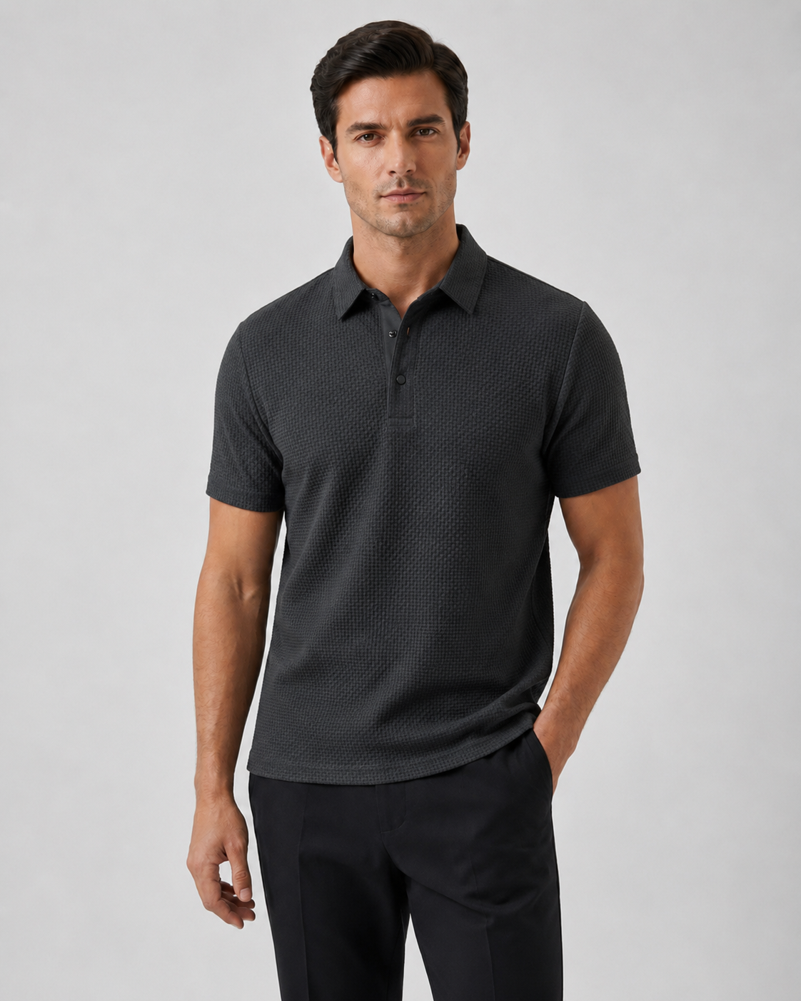 Model wearing the charcoal Siena Weave Polo Shirt with dark tailored trousers