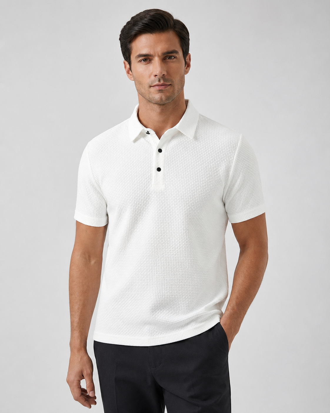Model wearing the white Siena Weave Polo Shirt with dark tailored trousers