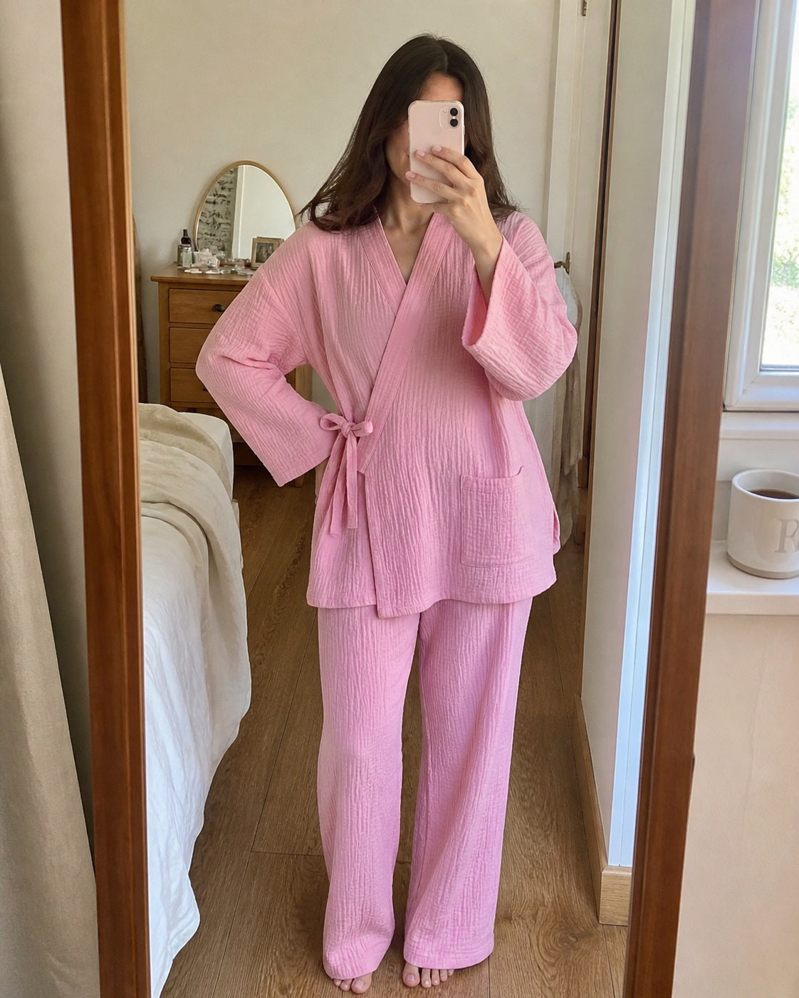 Woman wearing the pink Yoake Kimono Set in a mirror selfie